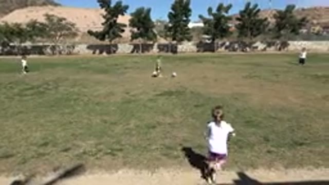 LOS CABOS MEXICO-2019: Little Girl Runs To Kick The Rolling Soccer Ball