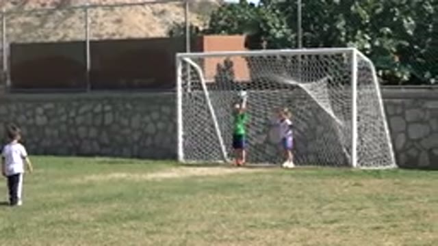 LOS CABOS MEXICO-2019: Children Practicing Soccer Together With A Man Who Is