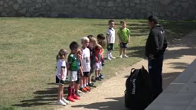 LOS CABOS MEXICO-2019: Children Standing In A Line Practicing Soccer