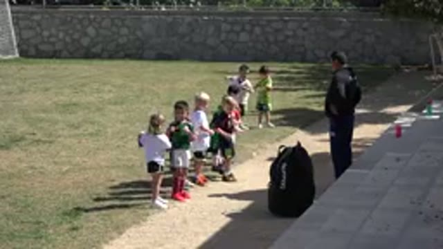 LOS CABOS MEXICO-2019: Children In Class Session Doing Supersizes On A Big Green Field