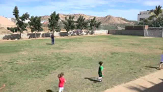LOS CABOS MEXICO-2019: Very Small Child Playing on a Football Field