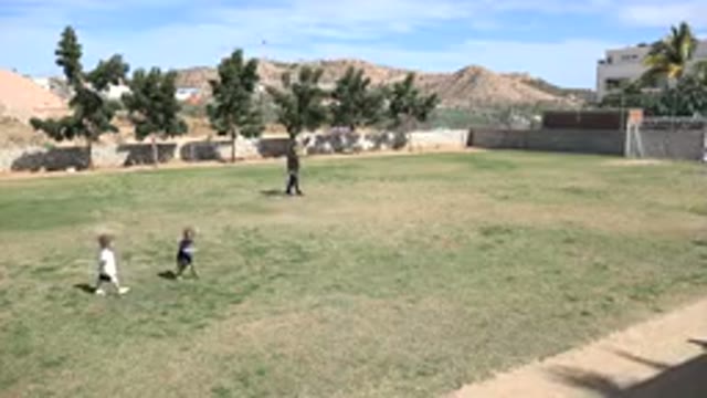 LOS CABOS MEXICO-2019: Children Play Sports On The Grass Guided By An Instructor