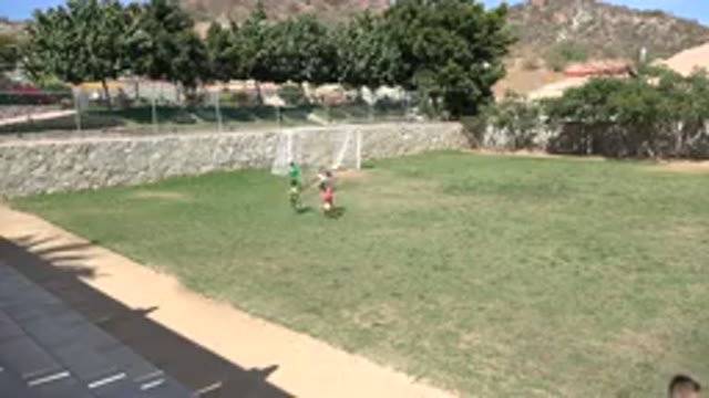 LOS CABOS MEXICO-2019: Small Boys Running On Soccer Field