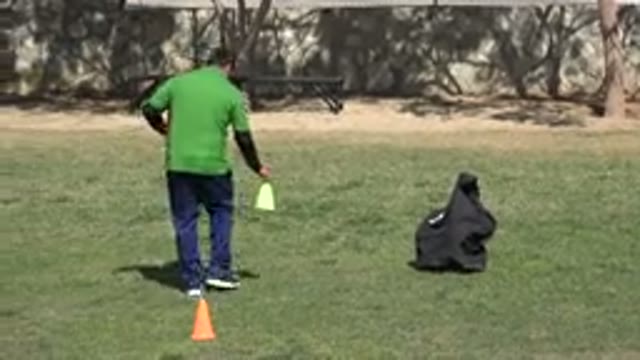 LOS CABOS MEXICO-2019: A Coach Puts Down Soccer Cones On The Field Just Before