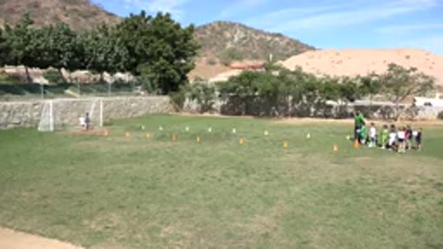 LOS CABOS MEXICO-2019: Children Line Up Behind Coach To Practice Shooting Goals
