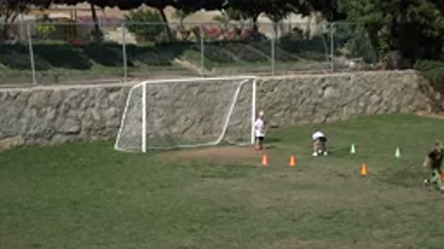 LOS CABOS MEXICO-2019: Cute Kids Playing Football on a Green Wide Field