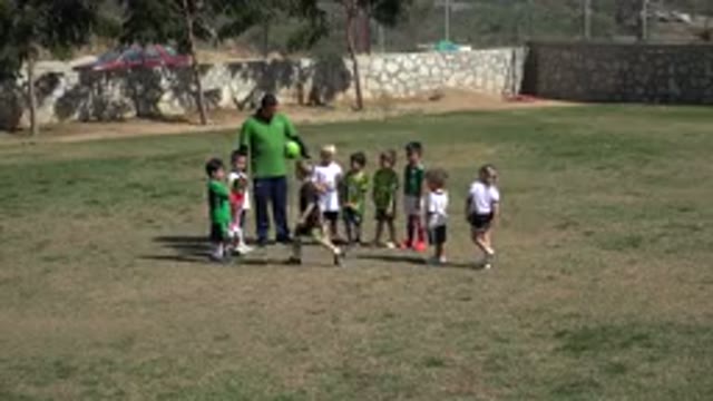 LOS CABOS MEXICO-2019: Groups Of Children With Their Coach Getting Ready For A Football Game