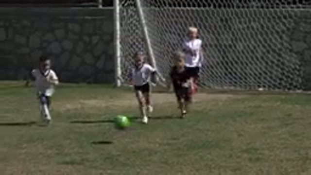 LOS CABOS MEXICO-2019: A Bunch of Kids Kicking a Ball in a Game of Soccer