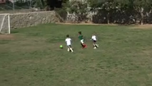 LOS CABOS MEXICO-2019: Small Children Practice Dribbling A Football And