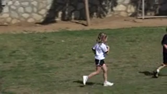 LOS CABOS MEXICO-2019: Children Play With A Soccer Ball In A Field Of Green