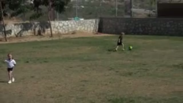 LOS CABOS MEXICO-2019: Kid Dribbles Ball Towards Goal Posts And Tries To Score
