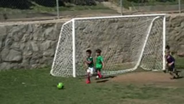 LOS CABOS MEXICO-2019: Many Children Playing Soccer With A Green Ball On A
