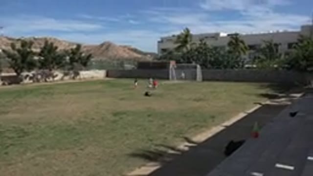 LOS CABOS MEXICO-2019: Children Soccer Field Ball Rolling Playing Running
