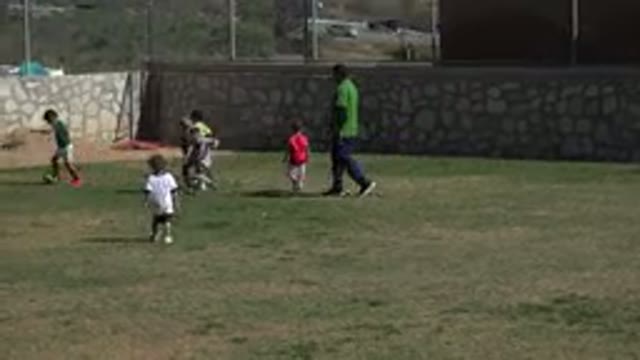 LOS CABOS MEXICO-2019: Children Playing Soccer in Open Field