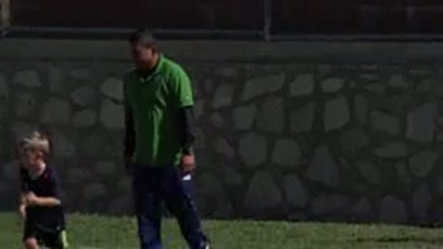 LOS CABOS MEXICO-2019: Coach Is Watching The Kids Playing Ball On The Grassy