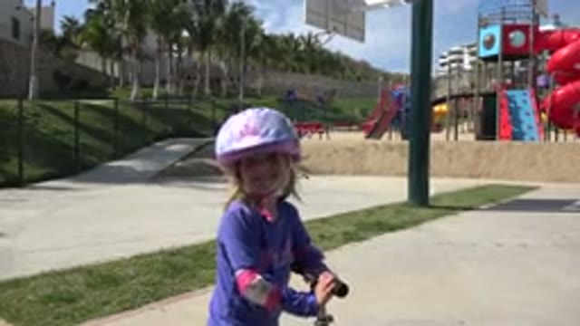 LOS CABOS MEXICO-2019: Smiling Girl With A Helmet After Riding A Scooter In A Park