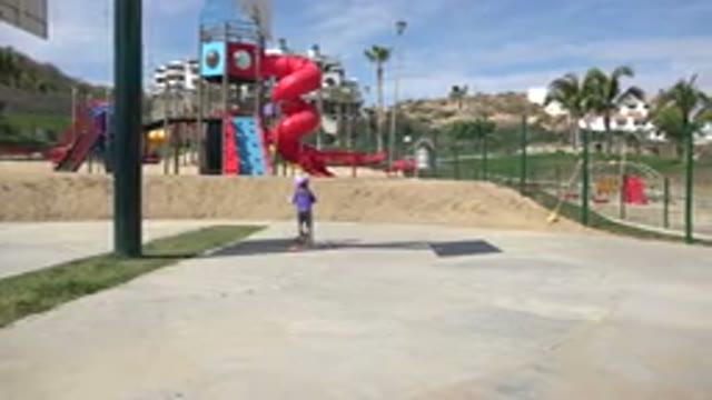 LOS CABOS MEXICO-2019: Fun In The Park Child Playing With A Scooter On A