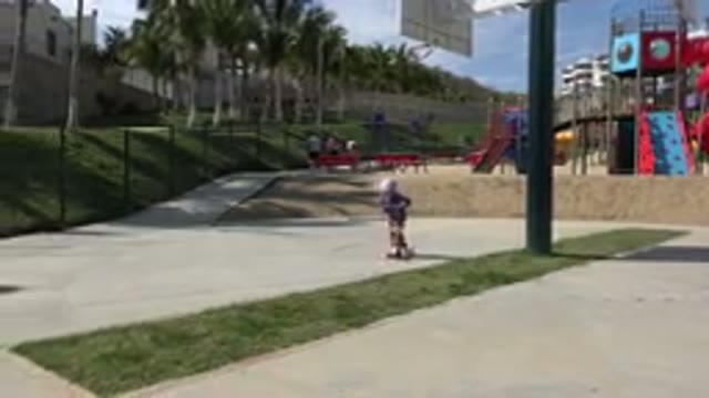 LOS CABOS MEXICO-2019: Little Girl Mastering The Fundamentals Of Riding A Scooter