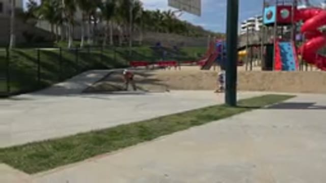 LOS CABOS MEXICO-2019: Children Riding Scooters at a Playground