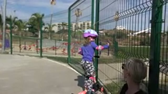 LOS CABOS MEXICO-2019: Little Girl Stops Playing Her Skating Bike To Drink A