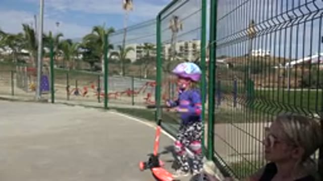 LOS CABOS MEXICO-2019: Little Girl Rests Then Rides Her Scooter