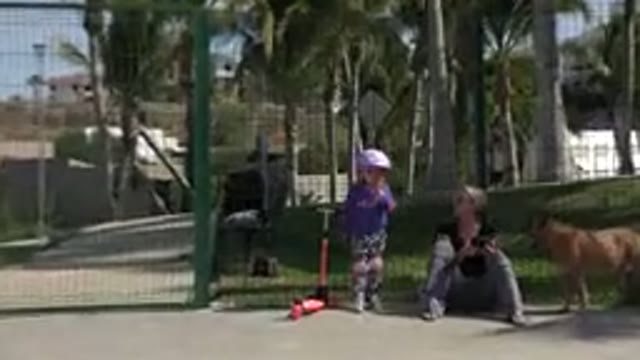 LOS CABOS MEXICO-2019: Child With Scooter Next To Woman And Dog