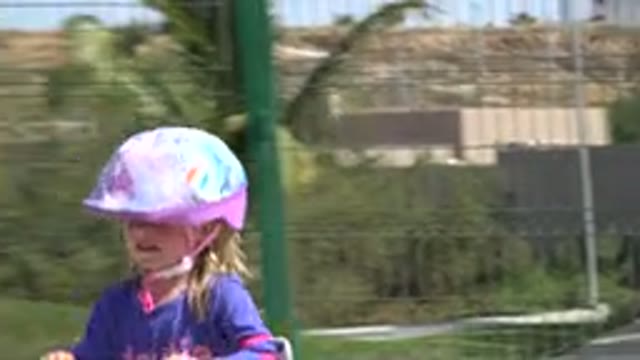 LOS CABOS MEXICO-2019: Little Blonde-Haired Girl Wears A Helmet While Playing