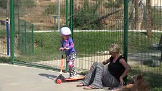 LOS CABOS MEXICO-2019: A Young Girl Wearing A Bicycle Helmet Accompanies Her Mother