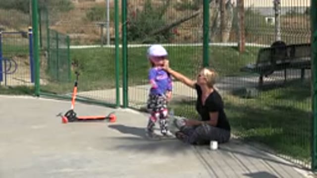 LOS CABOS MEXICO-2019: Crying Young Girl With Scooter At Skatepark Comforted By Mum