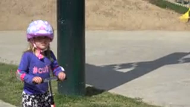 LOS CABOS MEXICO-2019: Child Going On A Scooter With A Helmet In An Inhabited Area