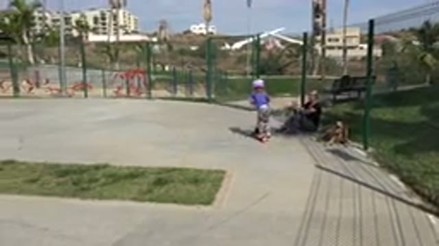 LOS CABOS MEXICO-2019: Mom And Daughter At Park With Dog While Daughter Scooters