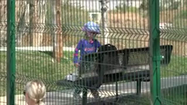 LOS CABOS MEXICO-2019: Young Girl With Bicycling Equipment Opens A Gate