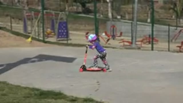 LOS CABOS MEXICO-2019: Kid Playing Park Sunny Day Playground Riding Track Grass