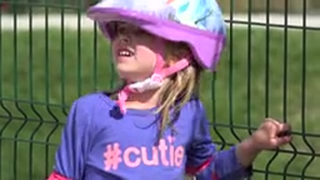 LOS CABOS MEXICO-2019: Young Girl Prepares To Go Bike Riding By Wearing A Helmet