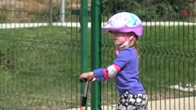 LOS CABOS MEXICO-2019: Little Kid Riding A Scooter In The Playground In A Sunny Day