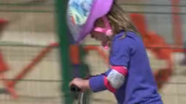 LOS CABOS MEXICO-2019: Little Girl Enjoying Sunny Day Riding Bikes in the Park