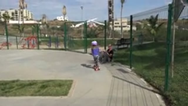 LOS CABOS MEXICO-2019: Little Girl Plays With Scooter Safely In The Park While
