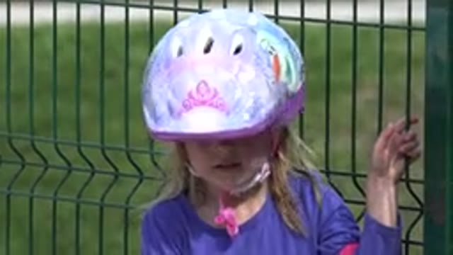 LOS CABOS MEXICO-2019: Little Girl Wearing Purple Shirt and Frozen Bicycle
