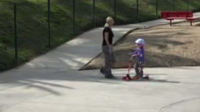LOS CABOS MEXICO-2019: A Mom Is Helping Her Little One Practicing Scooter