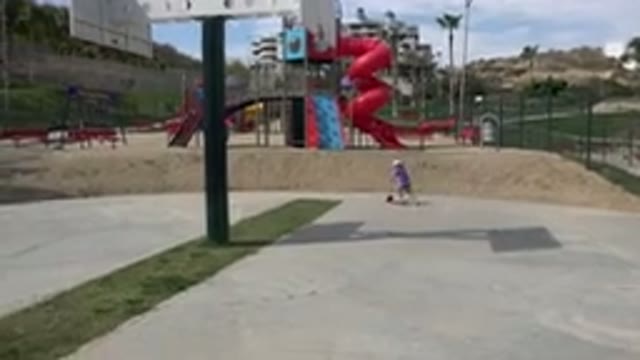 LOS CABOS MEXICO-2019: Child With Helmet Rides Scooter Near Playground