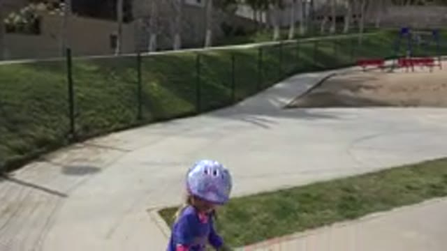 LOS CABOS MEXICO-2019: Little Girl Figuring Out How To Ride A Scooter Without