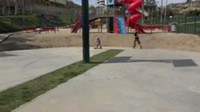 LOS CABOS MEXICO-2019: Father Playing With His Child Who Is Using A Scooter In A