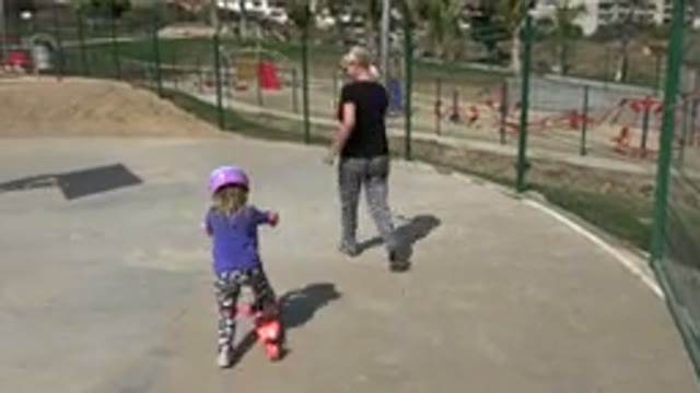 LOS CABOS MEXICO-2019: Mother Teaching Daughter To Ride Scooter In Park