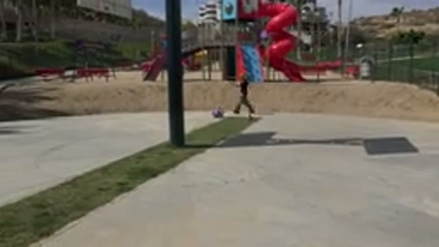 LOS CABOS MEXICO-2019: Child Falls Off Scooter As Adult Rushes In To Help