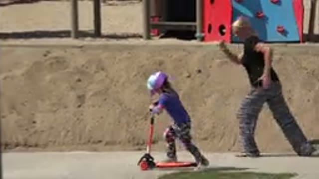 LOS CABOS MEXICO-2019: Adult Female Races Young Child On Her Feet While Child