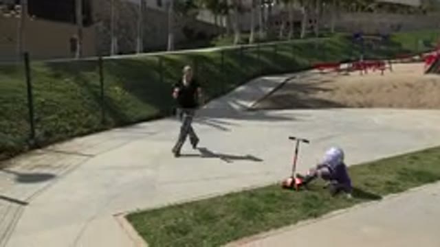 LOS CABOS MEXICO-2019: Mother Helps Her Little Girl Who Falls From Riding A Scooter
