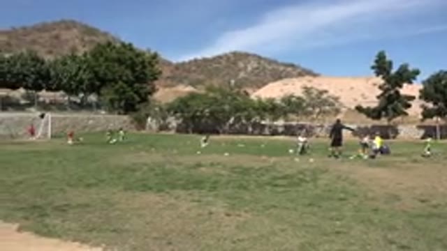 LOS CABOS MEXICO-2019: Children Learn How To Play Football By Shooting At The
