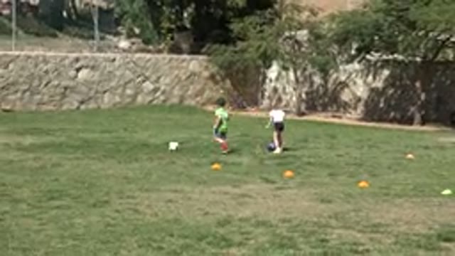 LOS CABOS MEXICO-2019: Little Girl Learns to Play Football Together With Her
