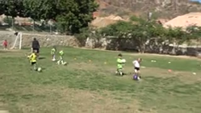 LOS CABOS MEXICO-2019: A Girl Kicks A Soccer Ball Outdoors In Daytime