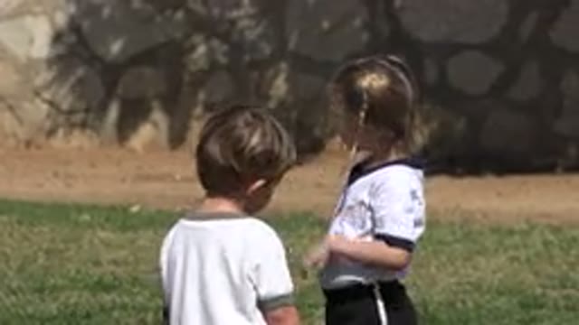 LOS CABOS MEXICO-2019: Children In A Green Park Playing With A Football In The